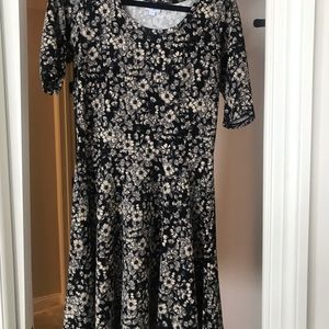 3 LulaRoe items. A duster and 2 dresses